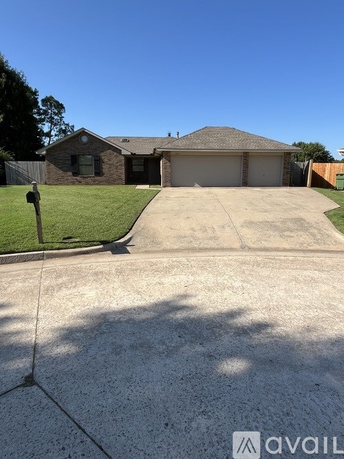 A house with a driveway in front of it.