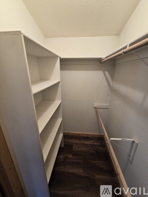 A small, empty room with a staircase leading to the second floor.