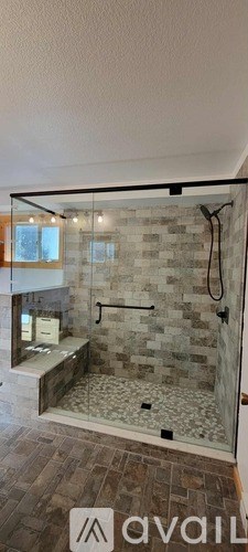 A bathroom with a walk-in shower and a bathtub.