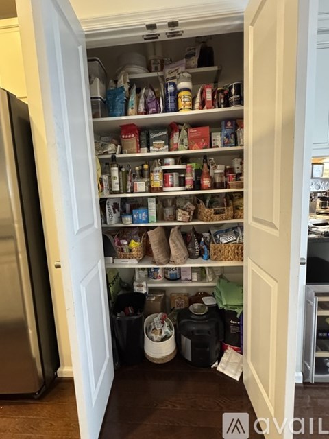 A pantry with a lot of items on the shelves.