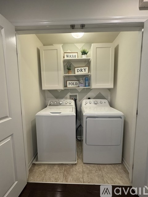A laundry room with a washer and dryer.