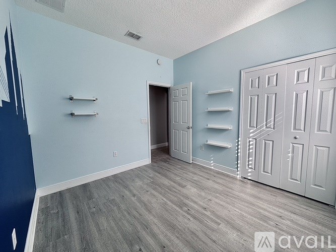 A room with blue walls and white doors.