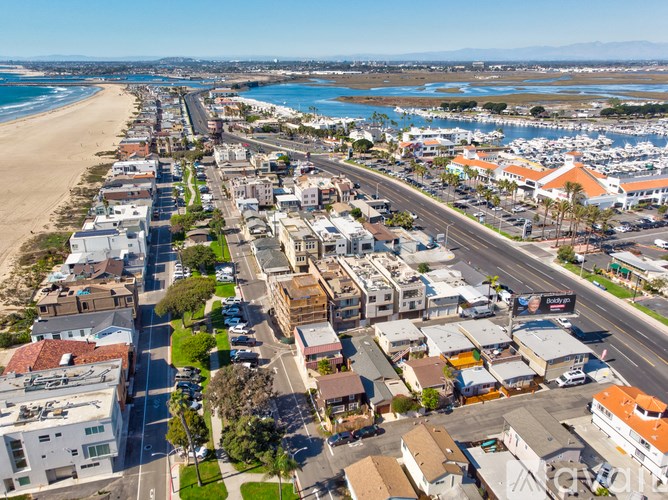 A beachfront city with a long stretch of sandy beach.