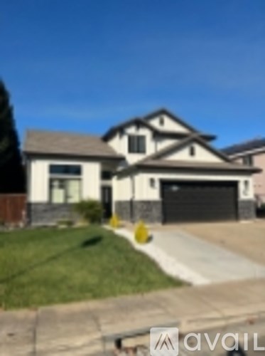 A house with a driveway in front of it.