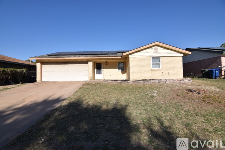 A house with a garage is for sale.