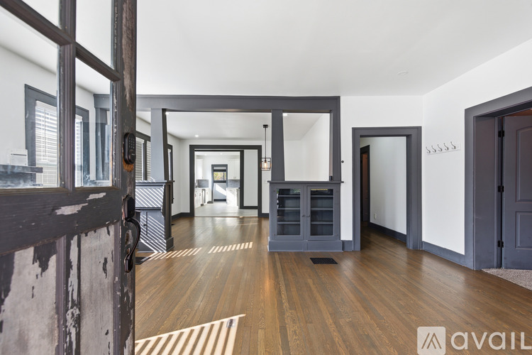 A room with wooden floors and a large open space.