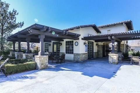 A large house with a covered patio area.