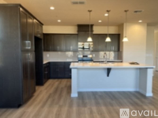 A modern kitchen with a large island in the middle.