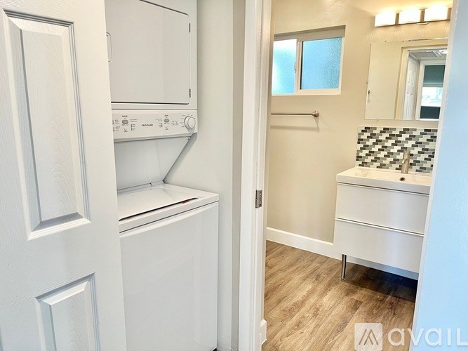 A white washer and dryer in a small laundry room.