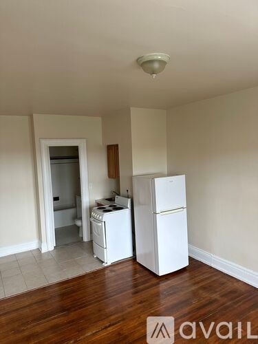 A kitchen with a white fridge and a white dishwasher.