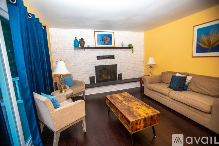 A living room with a fireplace and a couch.