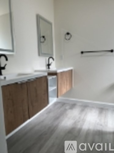 A bathroom with a sink and mirror.