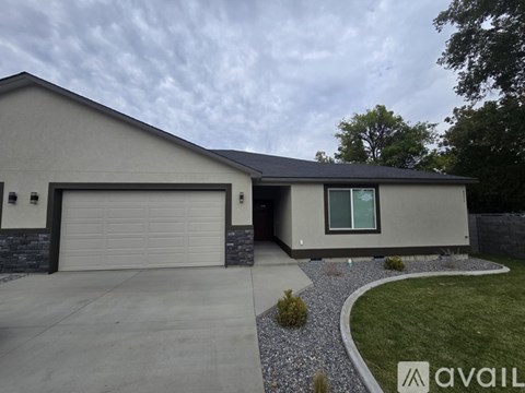 A modern house with a garage and a driveway.