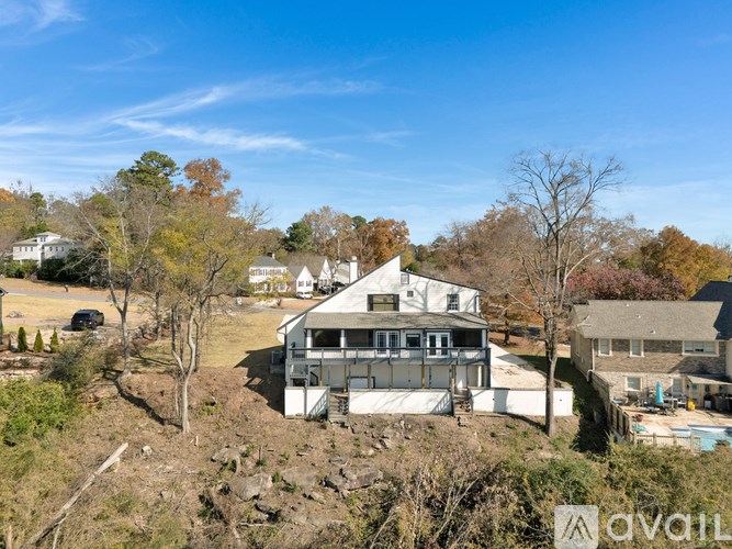A house with a large front yard is for sale.