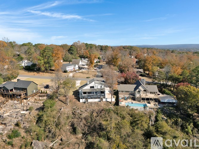 A bird's eye view of a residential area with houses and trees.