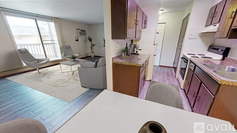 A kitchen and living room are shown in this image.