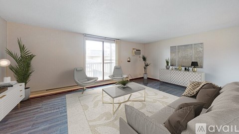 A living room with a grey couch and a white chair.