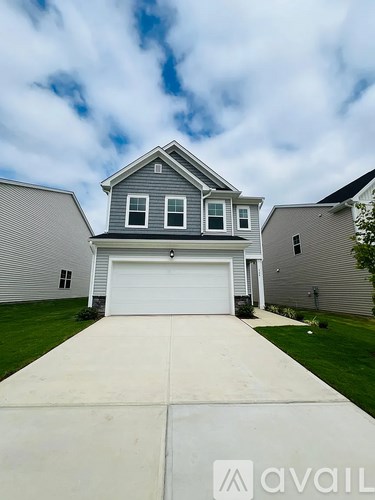 A house with a garage is shown in the image.