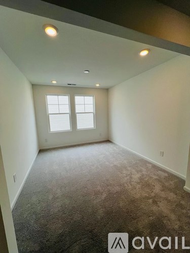 A room with Avail logo on the floor.