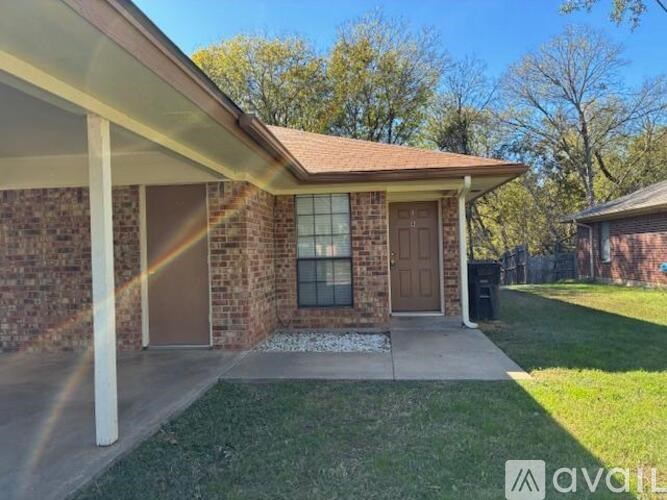 A house with a brown door and a brown roof.
