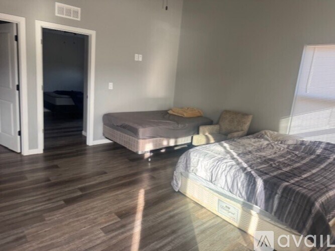 A bedroom with a bed and a mattress in it.