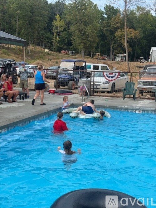 A group of people are enjoying a day at the pool.