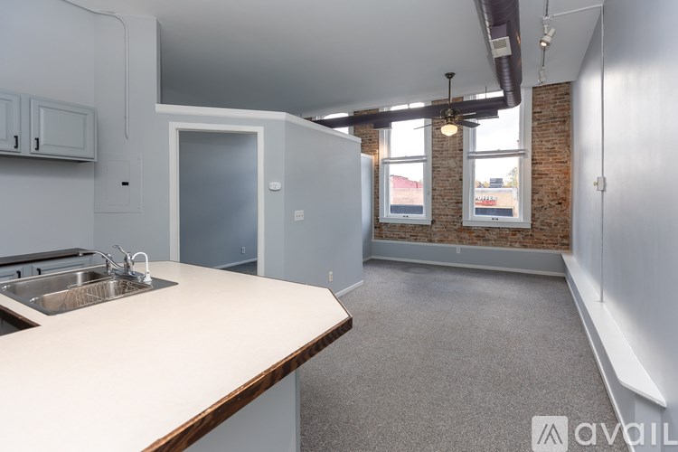 A kitchen with a sink and a countertop.
