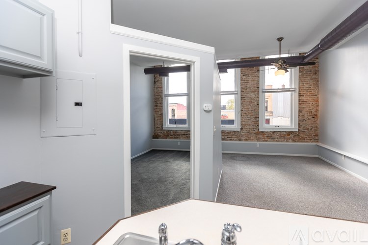 A kitchen with a sink and a window.