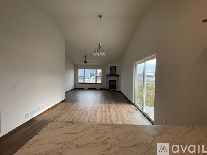 A white bathroom with a walk in shower and toilet.