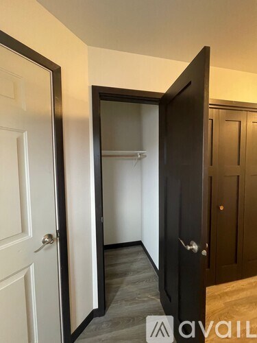 A white bathtub with a shower head and faucet.