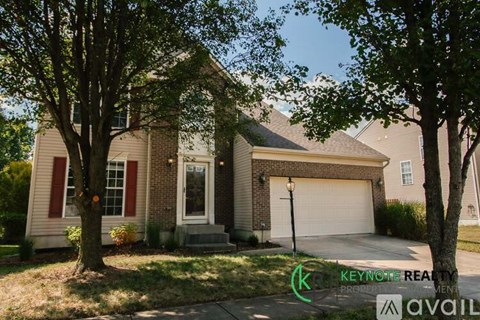 A house with a red and white front door is for sale.