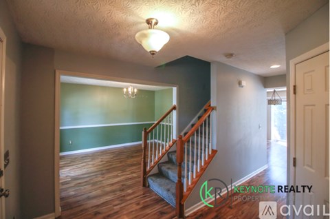 A room with a staircase leading to the second floor.