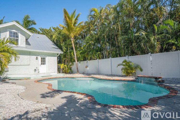 A house with a pool in the backyard.
