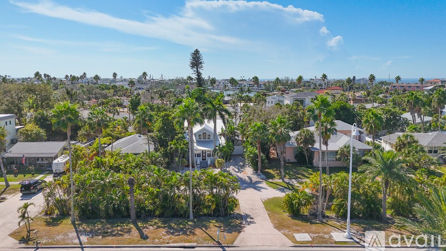 A bird's eye view of a residential area with houses and trees.