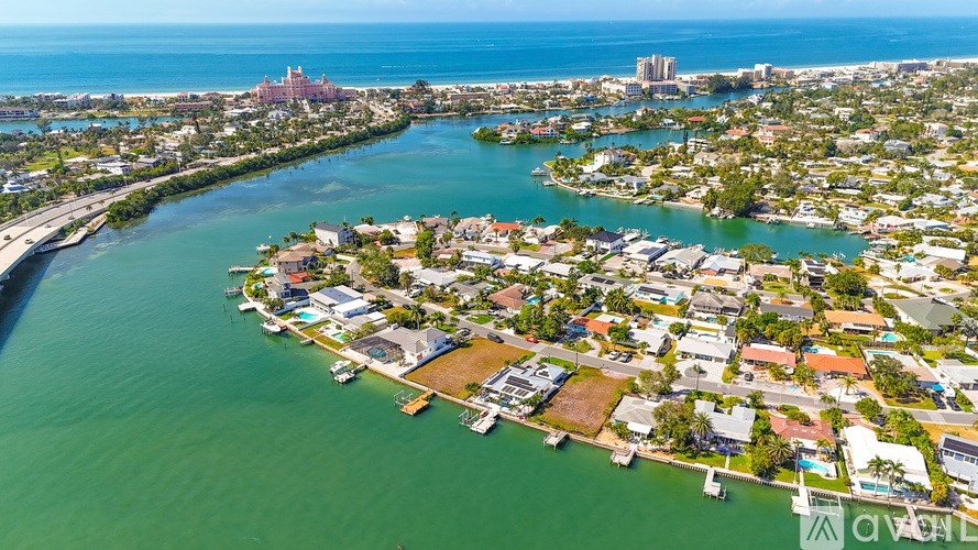A bird's eye view of a coastal city with a river running through it.