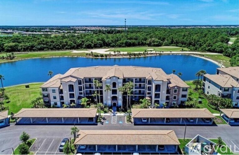 A large resort with a pool and a parking lot.