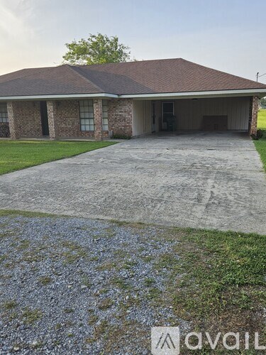 A house with a driveway in front of it.