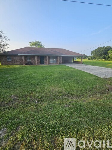 A house with a lawn in front of it.
