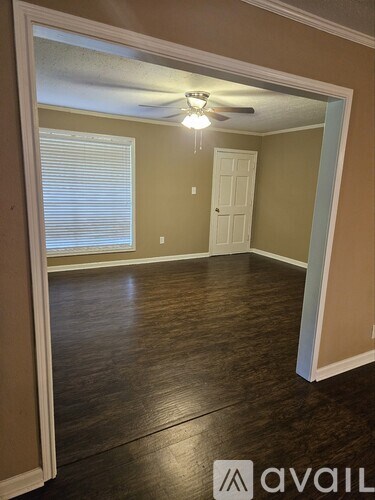 A room with brown walls and a white door.