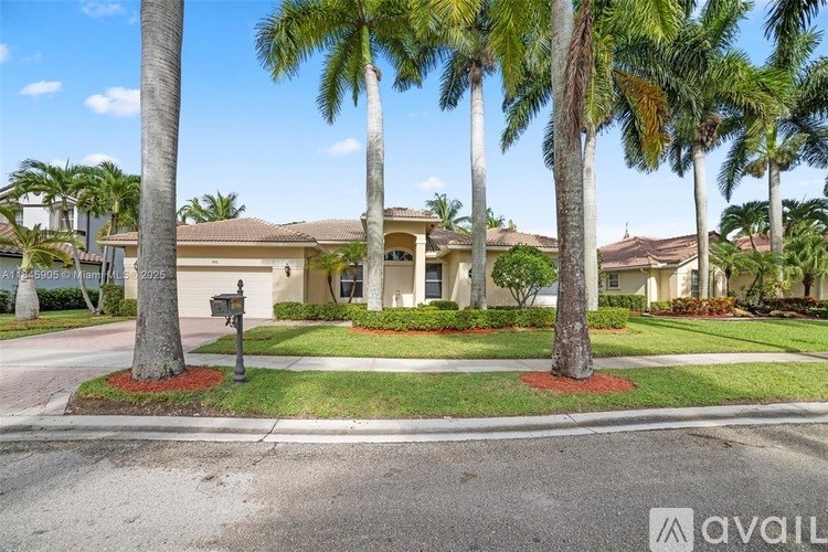 A house with a palm tree in front of it.