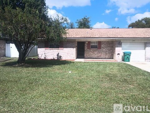 A house with a tree in front of it.