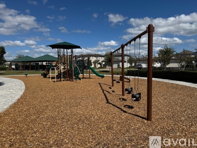 A playground with swings and a slide.