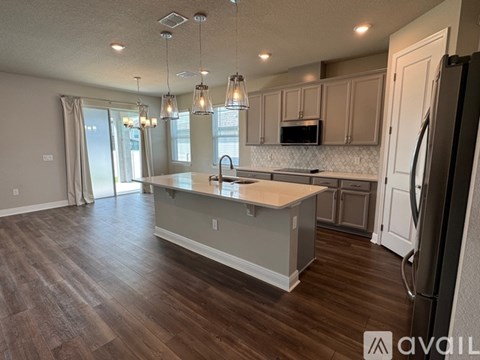 A kitchen with a large island in the middle of the room.