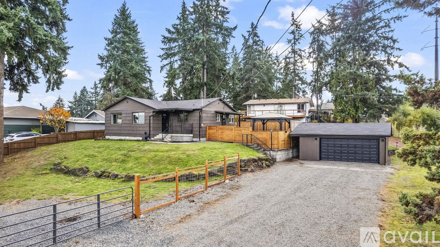 A house with a garage is available for sale.