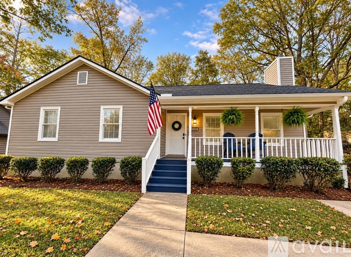 A house with a flag on the front porch.
