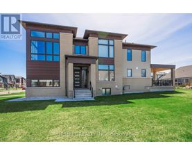 A modern house with a large front yard is for sale.