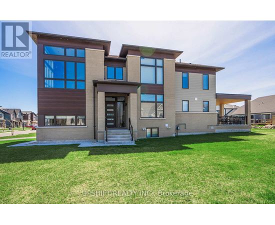 A modern house with a large front yard is for sale.