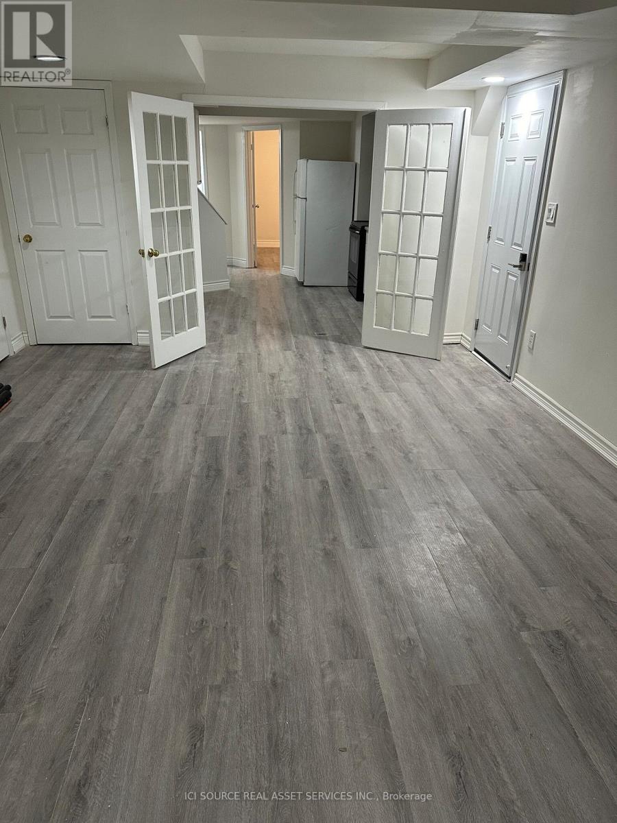 A room with a grey floor and white walls.