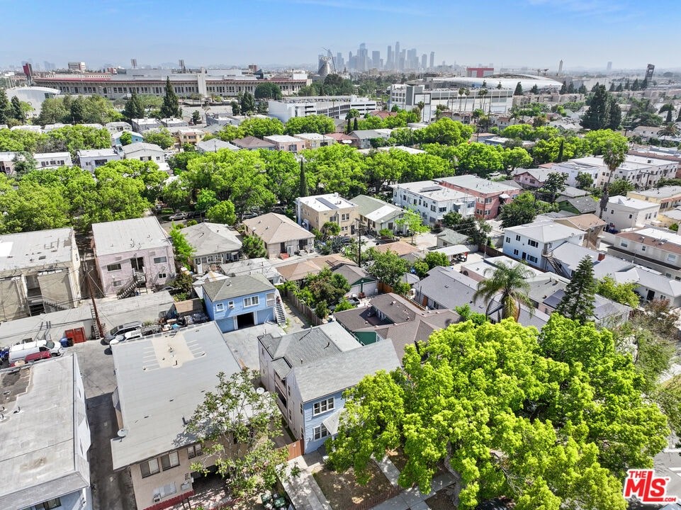 A bird's eye view of a residential area with houses and trees.
