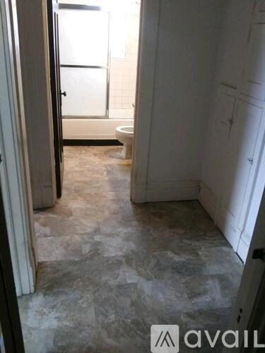 A bathroom with a toilet and a walk-in shower.